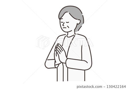An elderly woman praying An elderly woman praying 130422164