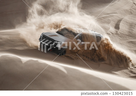 White SUV driving through desert sand, Saudi Arabia White SUV driving through desert sand, Saudi Arabia 130423015