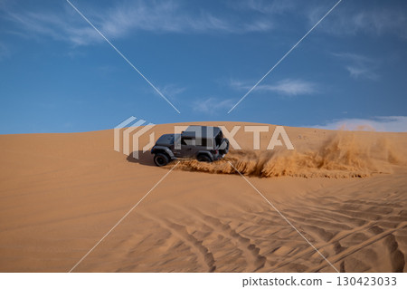 Jeep off-road driving on sand dunes, Saudi Arabia Jeep off-road driving on sand dunes, Saudi Arabia 130423033
