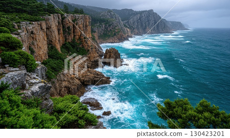 Breathtaking coastal scenery showcasing towering cliffs meeting the turquoise ocean, where rugged rocks and lush vegetation create a dramatic seascape along the coastline 130423201