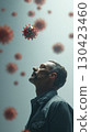 Man looking at floating red viruses in a conceptual health representation 130423460