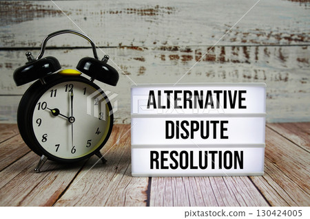 ADR Alternative Dispute Resolution text on light box with alarm clock on wooden background ADR Alternative Dispute Resolution text on light box with alarm clock on wooden background 130424005