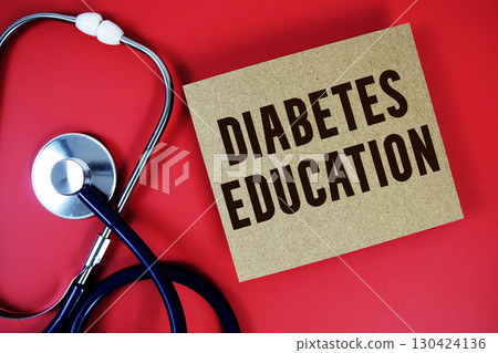 Diabetes Education text written on paper card with stethoscope on red background Diabetes Education text written on paper card with stethoscope on red background 130424136