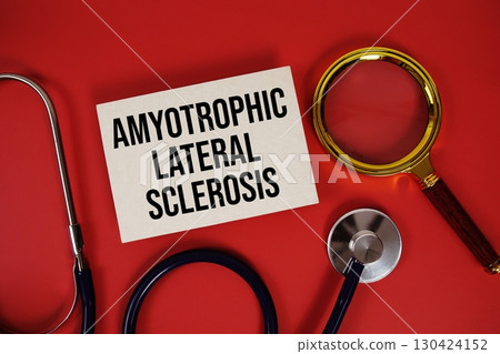 Amyotrophic Lateral Sclerosis text written on paper card with stethoscope and magnifying glass on red background 130424152