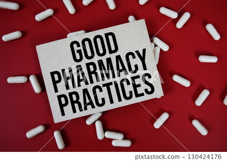 Good Pharmacy Practices text written on paper card with medicine capsule on red background Good Pharmacy Practices text written on paper card with medicine capsule on red background 130424176
