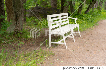 White bench. Monrepos Park, rocky landscape park White bench. Monrepos Park, rocky landscape park 130424318