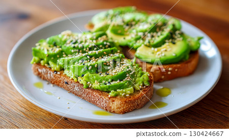 Avocado toast with avocado puree, sesame seeds and olive oil, healthy vegan breakfast and healthy eating concept 130424667
