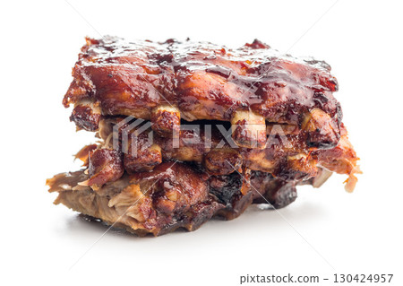Pork BBQ glazed ribs isolated on white background. Pork BBQ glazed ribs isolated on white background. 130424957