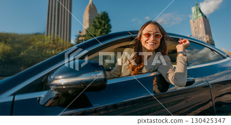 Embarking on a joyful and thrilling road trip adventure in an exciting urban setting 130425347