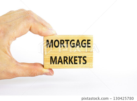 Mortgage markets symbol. Concept words Mortgage markets on beautiful wooden blocks. Beautiful white table white background. Businessman hand. Business mortgage markets concept. Copy space. Mortgage markets symbol. Concept words Mortgage markets on beautiful wooden blocks. Beautiful white table white background. Businessman hand. Business mortgage markets concept. Copy space. 130425780