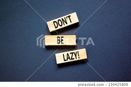 Motivational and do not be lazy symbol. Concept words Do not be lazy on wooden blocks on a beautiful black table black background. Business do not be lazy concept. Copy space. Motivational and do not be lazy symbol. Concept words Do not be lazy on wooden blocks on a beautiful black table black background. Business do not be lazy concept. Copy space. 130425809