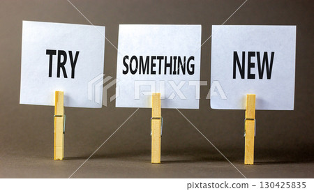 Try something new symbol. Concept words Try something new on beautiful white paper on wooden clothespin. Beautiful grey background. Business motivational lifestyle try something new concept Copy space 130425835