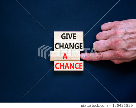 Give change a chance symbol. Concept words phrase Give change a chance on beautiful wooden blocks. Beautiful black paper background. Businessman's hand Business Give change a chance concept Copy space Give change a chance symbol. Concept words phrase Give change a chance on beautiful wooden blocks. Beautiful black paper background. Businessman's hand Business Give change a chance concept Copy space 130425839
