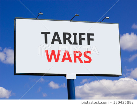 Trade tariff wars symbol. Concept word Tariff wars on beautiful white billboard. Beautiful blue sky and clouds background. Business trade tariff wars concept concept. Copy space. 130425892
