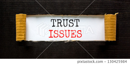 Trust issues symbol. Concept word Trust issues on beautiful white paper. Beautiful black paper background. Business trust issues concept. Copy space. 130425984