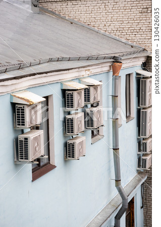 air conditioners are installed on the wall of the building. cooling in hot weather. air conditioners are installed on the wall of the building. cooling in hot weather. 130426035