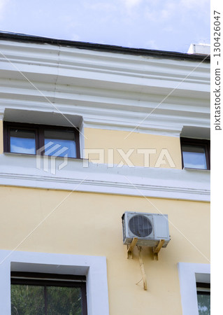 air conditioner is mounted on wall. technologies for air cooling in hot weather. air temperature air conditioner is mounted on wall. technologies for air cooling in hot weather. air temperature 130426047