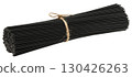 Bunch of dry black pasta tied with twine, isolated background 130426263