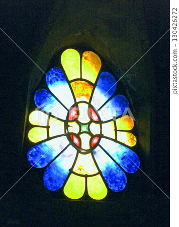 Stained glass window in the bell tower of Colonia Güell Church, a Gaudi building in Salvalo, Spain 130426272