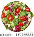 Plate of fresh salad with mixed greens, cherry tomatoes and mozzarella balls. 130426283