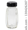 Empty glass salt shaker with black plastic lid, isolated background 130426287