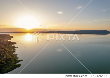 Spectacular sunset over lake Balaton with golden reflections, Hungary. 130426583