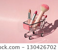 Mini cart filled with nude and red lipsticks and pink makeup brush on pastel pink background for feminine ecommerce or promotions 130426702