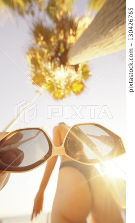 A Bright and Sunny Beach Day Filled with Stylish Sunglasses and Beautiful Palm Trees A Bright and Sunny Beach Day Filled with Stylish Sunglasses and Beautiful Palm Trees 130426765