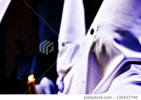 Nazarene-penitent, during the Holy Week procession in Alcala de Guadaira, Andalusia, Seville.	 130427740