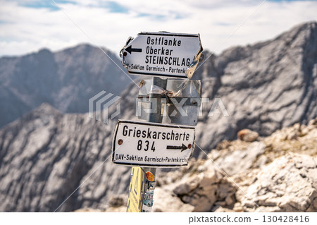Trail Sign At Grieskarscharte In The Bavarian Alps: Hiking Direction To Garmisch-Partenkirchen And Alpspitze Routes 130428416