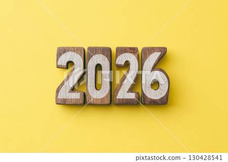 Wooden numbers 2026 on a yellow background. Concept 2026 New Year. Wooden numbers 2026 on a yellow background. Concept 2026 New Year. 130428541
