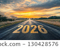 The text 2026 on the road with beautiful natural landscape and sunset sky. 130428576