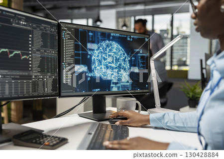 Trader in office utilizing AI LLM chatbot for instant market analysis and trading tips. Financial expert integrating AI analytics to monitor and react to global financial news 130428884