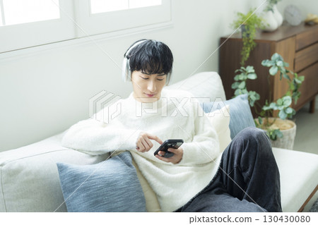 A man operating a smartphone 130430080