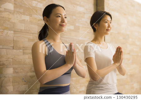 A woman who plays hot yoga 130430295