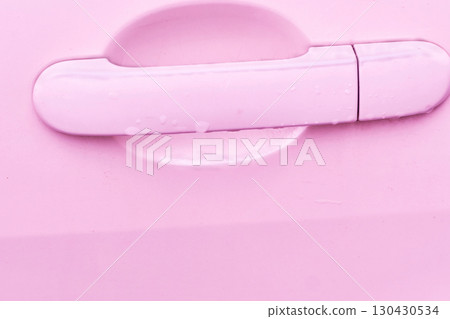 Pink women car door handle with drops after rain Pink women car door handle with drops after rain 130430534