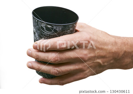 Coffee break. Men hand with a cup of coffee 130430611