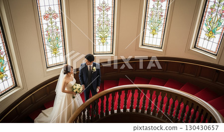 Spiral staircase and bride and groom 130430657
