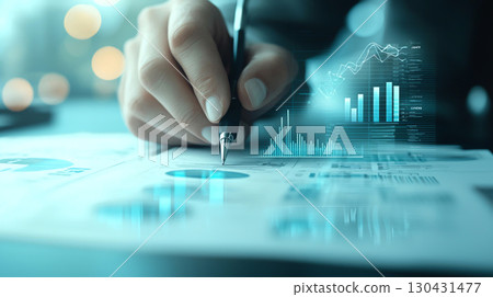 business owner analyzes financial data, focusing on charts and graphs to assess impact of tariffs on profits. image conveys sense of precision and strategic planning business owner analyzes financial data, focusing on charts and graphs to assess impact of tariffs on profits. image conveys sense of precision and strategic planning 130431477