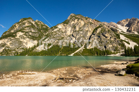 Emerald alpine lake Braies in Prags valley surrounded by Dolomites 130432231