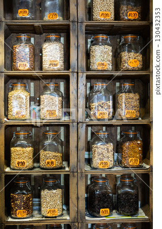 Various nuts and dried fruits sorted into jars 130432353