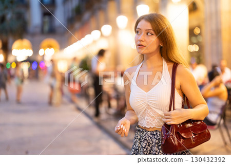 Young woman walking in Royal Square (Placa Real) in Barcelona Young woman walking in Royal Square (Placa Real) in Barcelona 130432392