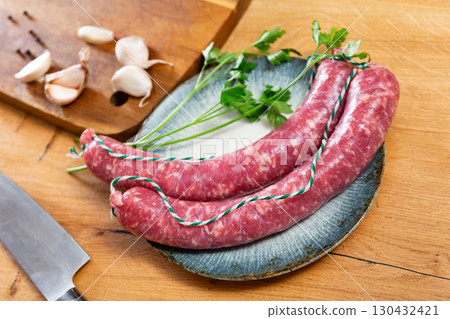 Sausages served with herbs to table Sausages served with herbs to table 130432421