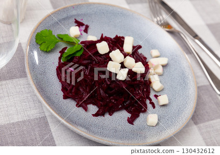 Salad with chopped beetroot and farmer cheese decorated with parsley Salad with chopped beetroot and farmer cheese decorated with parsley 130432612