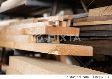 Stack of wooden planks in wood workshop Stack of wooden planks in wood workshop 130432991