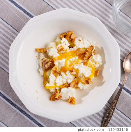 Catalan whey cheese, mato, served on plate with honey and walnuts 130433146