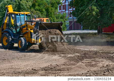 Bulldozer excavator bucket picking up the ground,soil on road repair Bulldozer excavator bucket picking up the ground,soil on road repair 130433234