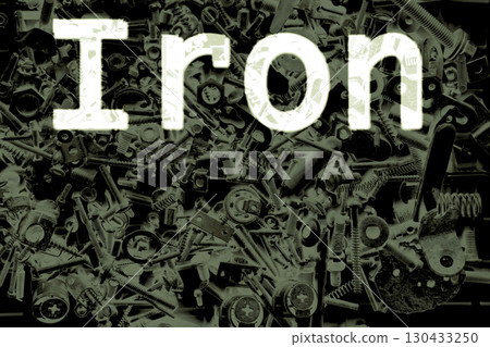 White inscription Iron on dark pile of all sorts of metal objects White inscription Iron on dark pile of all sorts of metal objects 130433250