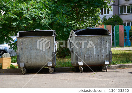 Metal containers for garbage,passages in courtyard of residential building Metal containers for garbage,passages in courtyard of residential building 130433260