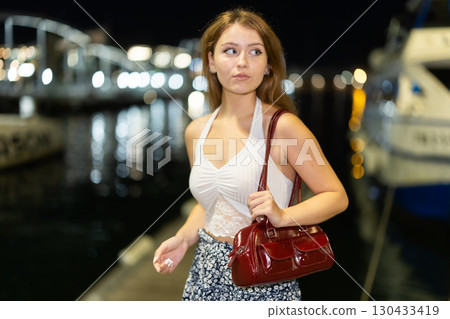 Young woman posing in Port Vell, Barcelona Young woman posing in Port Vell, Barcelona 130433419
